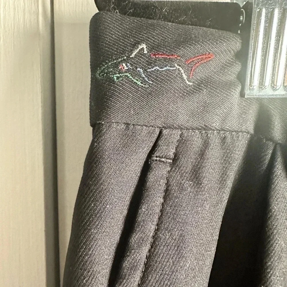 Greg Norman black, pleated golf slacks with a cuff.  Size 38x30
